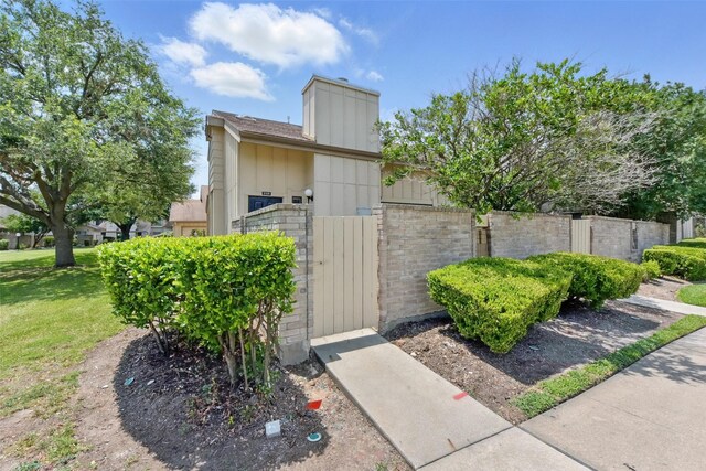 3126 Windchase Blvd Unit 421, Houston, TX 77082 - view of outbuilding featuring a gate