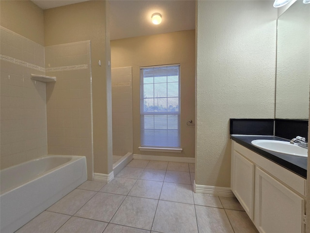 1944 Hillcroft, Prairie View, TX 77445 - full bath with a shower, vanity, tile patterned floors, a bath, and baseboards