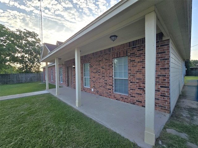 1944 Hillcroft, Prairie View, TX 77445 - view of side of home with brick siding and a patio