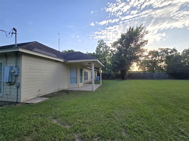 1944 Hillcroft, Prairie View, TX 77445 - yard at dusk featuring a patio area