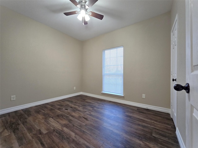 1944 Hillcroft, Prairie View, TX 77445 - unfurnished room featuring baseboards, ceiling fan, and dark wood-style flooring