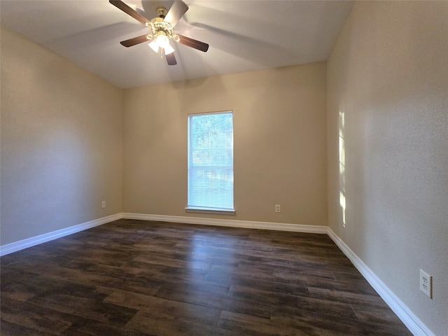 1944 Hillcroft, Prairie View, TX 77445 - spare room featuring dark wood-style floors, ceiling fan, and baseboards