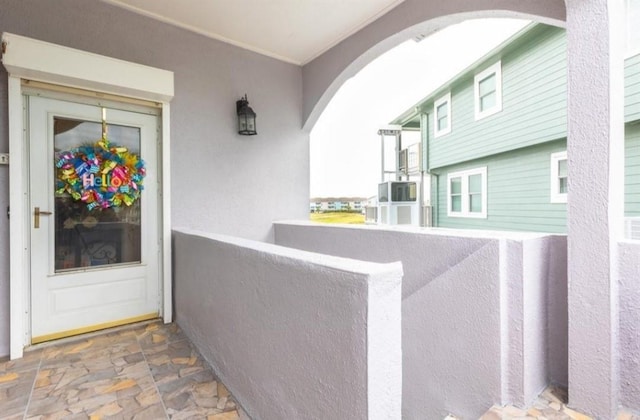 423 Hana Dr, Tiki Island, TX 77554 - property entrance with stucco siding