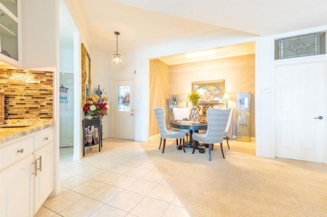 423 Hana Dr, Tiki Island, TX 77554 - dining space with light tile patterned floors and light colored carpet
