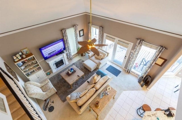 423 Hana Dr, Tiki Island, TX 77554 - carpeted living room featuring tile patterned floors and a fireplace