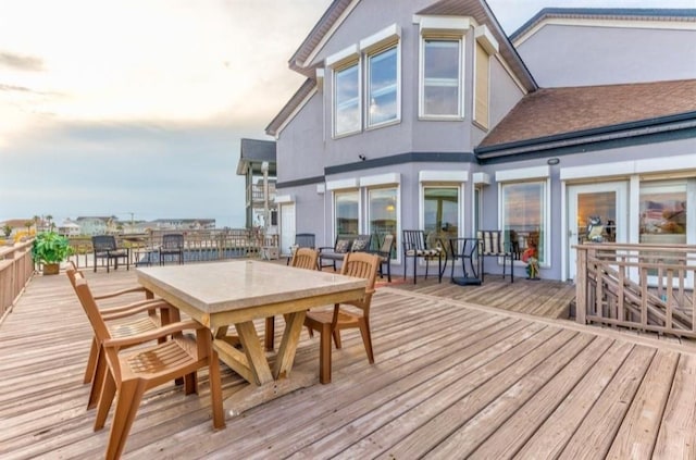 423 Hana Dr, Tiki Island, TX 77554 - wooden deck featuring outdoor dining area