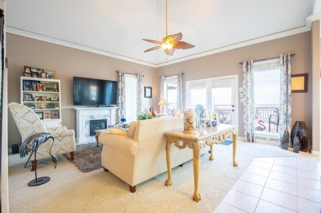 423 Hana Dr, Tiki Island, TX 77554 - living area with carpet, ornamental molding, a ceiling fan, a high end fireplace, and baseboards