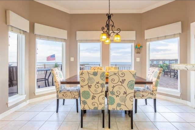 423 Hana Dr, Tiki Island, TX 77554 - dining room with crown molding, light tile patterned floors, and baseboards