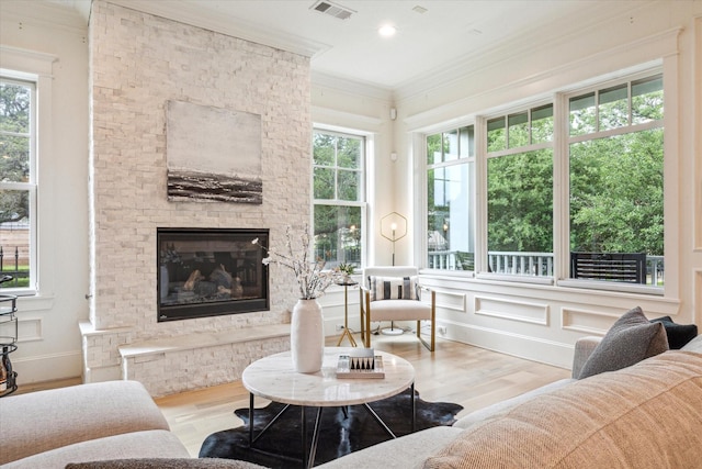 432 Marshall St, Houston, TX 77006 - living area featuring wood finished floors, ornamental molding, and a fireplace