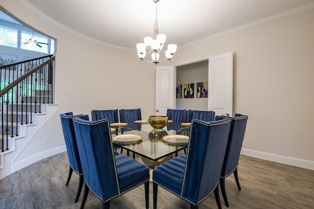 9411 Plaza Point Dr, Missouri City, TX 77459 - dining room featuring a chandelier, crown molding, wood finished floors, and baseboards