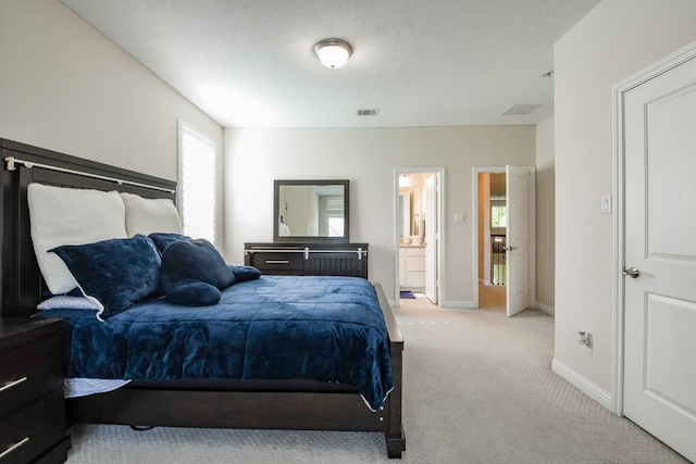 9411 Plaza Point Dr, Missouri City, TX 77459 - bedroom featuring light colored carpet, multiple windows, baseboards, and connected bathroom