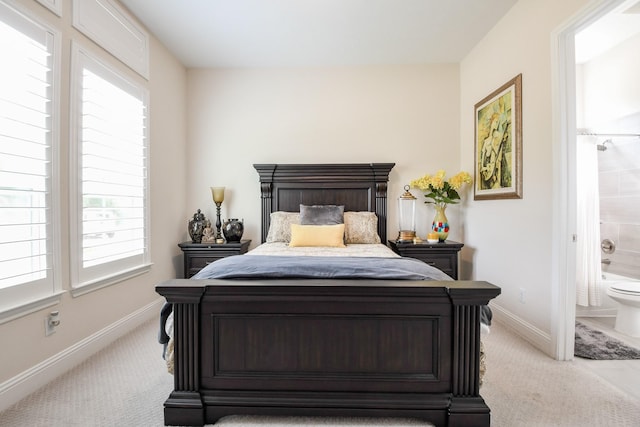 9411 Plaza Point Dr, Missouri City, TX 77459 - bedroom with light carpet, baseboards, and connected bathroom
