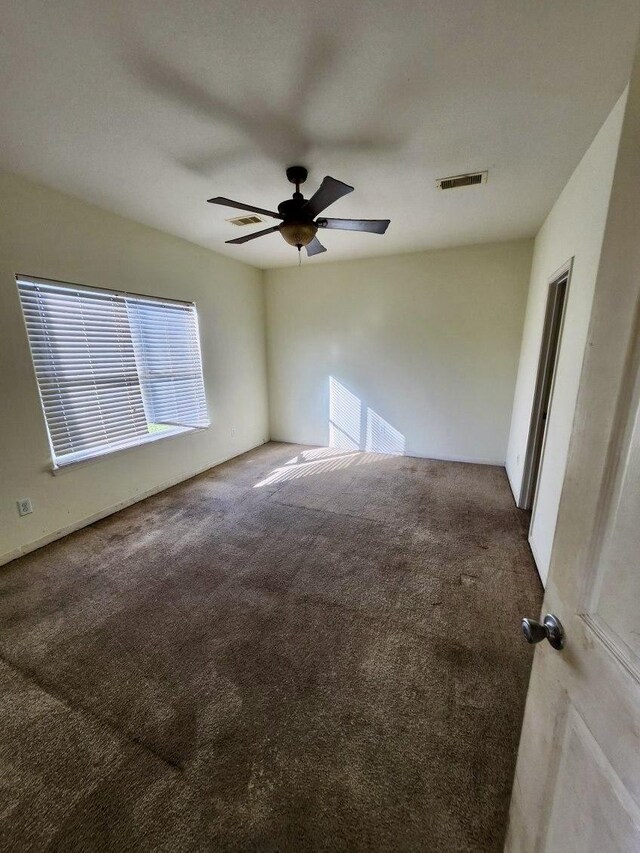 1015 Amaryllis Rd, Baytown, TX 77521 - carpeted spare room with a ceiling fan