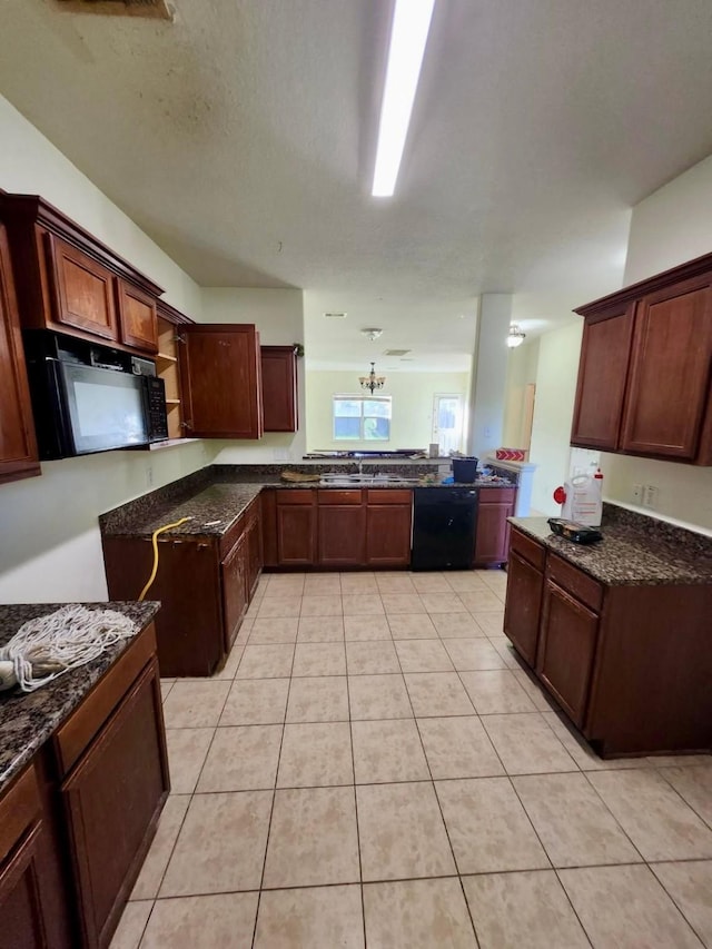 1015 Amaryllis Rd, Baytown, TX 77521 - kitchen featuring black appliances, light tile patterned floors, dark stone counters, a peninsula, and open shelves