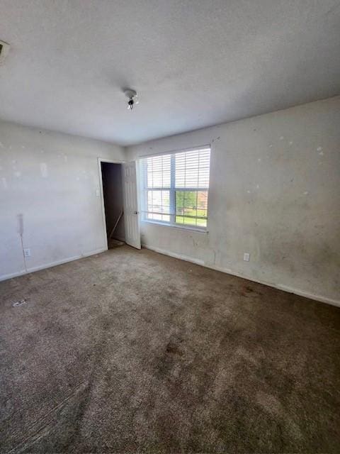 1015 Amaryllis Rd, Baytown, TX 77521 - carpeted spare room with baseboards