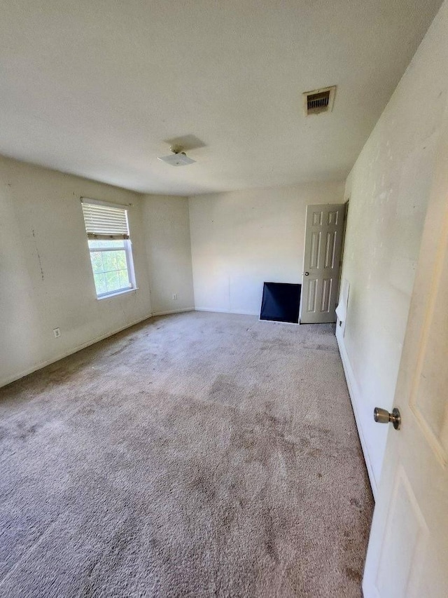 1015 Amaryllis Rd, Baytown, TX 77521 - unfurnished room with carpet flooring and baseboards
