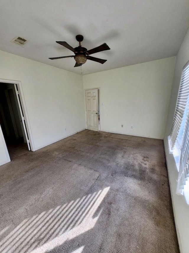 1015 Amaryllis Rd, Baytown, TX 77521 - spare room with carpet and a ceiling fan