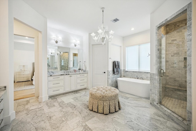 1505 Pine Chase Dr, Houston, TX 77055 - bathroom featuring vanity, a chandelier, a freestanding tub, a shower stall, and recessed lighting