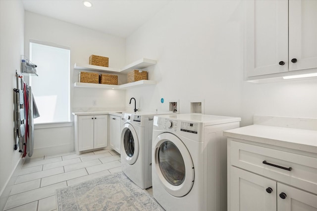 1505 Pine Chase Dr, Houston, TX 77055 - washroom with washing machine and clothes dryer, cabinet space, baseboards, light tile patterned floors, and recessed lighting