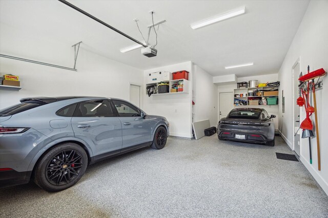 1505 Pine Chase Dr, Houston, TX 77055 - garage featuring a garage door opener and baseboards
