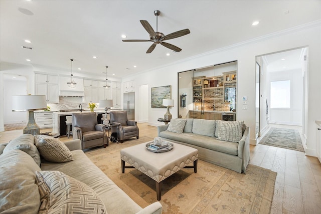 1505 Pine Chase Dr, Houston, TX 77055 - living area featuring ceiling fan, recessed lighting, baseboards, ornamental molding, and light wood-type flooring