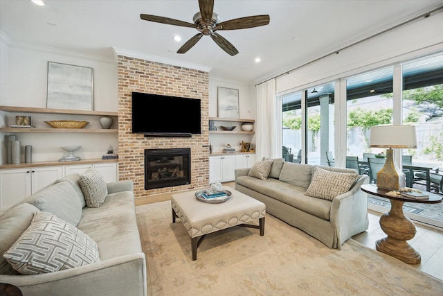 1505 Pine Chase Dr, Houston, TX 77055 - living room featuring ornamental molding, a ceiling fan, a brick fireplace, built in shelves, and recessed lighting