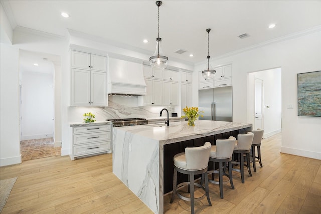 1505 Pine Chase Dr, Houston, TX 77055 - kitchen featuring stainless steel built in fridge, custom exhaust hood, a sink, ornamental molding, and light wood finished floors