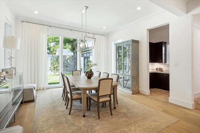 1505 Pine Chase Dr, Houston, TX 77055 - dining area featuring a chandelier, light wood-type flooring, ornamental molding, recessed lighting, and baseboards