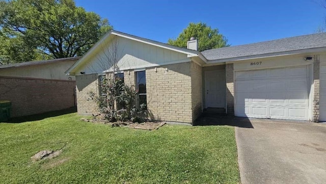8607 Sherrywood Dr, Houston, TX 77044 - view of front of house featuring brick siding, a garage, a chimney, and a front yard
