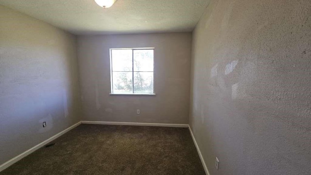 8607 Sherrywood Dr, Houston, TX 77044 - unfurnished room featuring dark colored carpet and baseboards