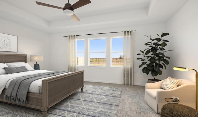 6220 Pelican Ridge Way, League City, TX 77573 - carpeted bedroom with a tray ceiling, baseboards, and a ceiling fan