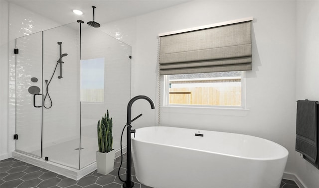 6220 Pelican Ridge Way, League City, TX 77573 - bathroom with a shower stall, a freestanding tub, and tile patterned flooring
