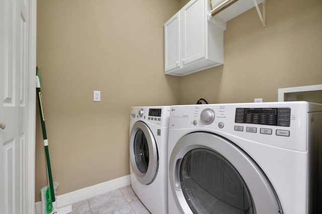 81 Baron Dr, Coldspring, TX 77331 - laundry area with cabinet space, independent washer and dryer, baseboards, and light tile patterned floors