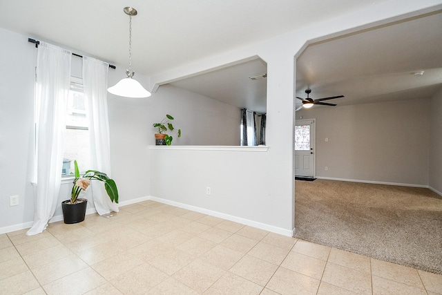 2739 Mustang Hill Ln, Katy, TX 77449 - spare room featuring a ceiling fan, baseboards, and light carpet