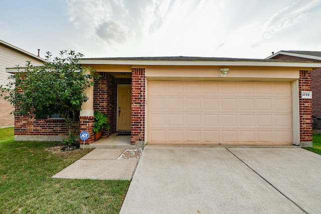2739 Mustang Hill Ln, Katy, TX 77449 - view of front facade with brick siding, concrete driveway, a garage, and a front yard