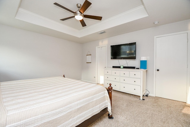 2739 Mustang Hill Ln, Katy, TX 77449 - bedroom with a tray ceiling, light colored carpet, ornamental molding, baseboards, and ceiling fan