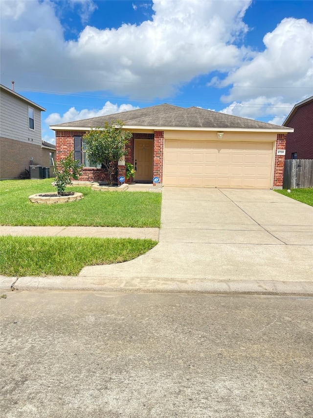 2739 Mustang Hill Ln, Katy, TX 77449 - ranch-style house with brick siding, concrete driveway, an attached garage, and a front lawn