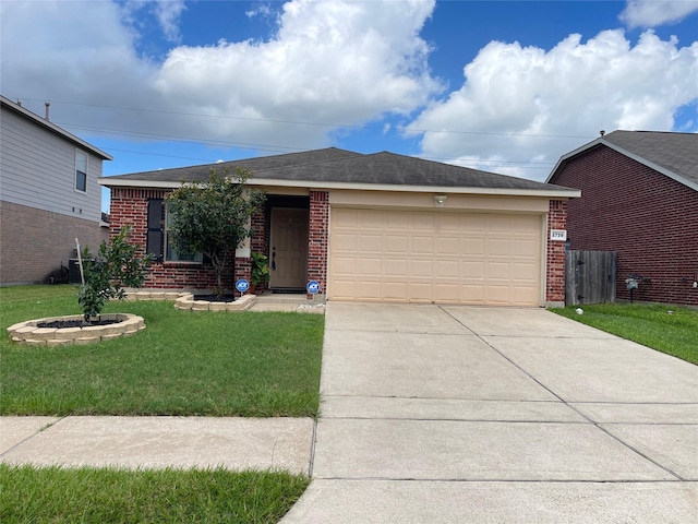 2739 Mustang Hill Ln, Katy, TX 77449 - ranch-style house with brick siding, a garage, and concrete driveway