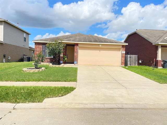 2739 Mustang Hill Ln, Katy, TX 77449 - ranch-style home featuring brick siding, an attached garage, concrete driveway, and a front lawn