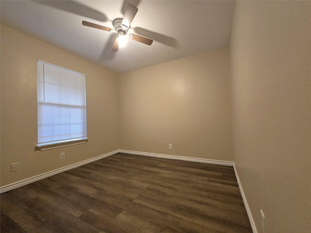 256 Alleda Rd, Prairie View, TX 77484 - spare room featuring dark wood-style floors, baseboards, and ceiling fan