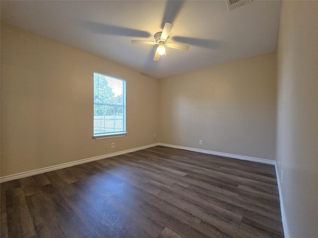 256 Alleda Rd, Prairie View, TX 77484 - empty room featuring dark wood-type flooring, ceiling fan, and baseboards
