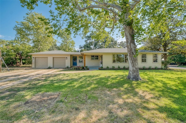 293 S College St, La Grange, TX 78945 - ranch-style home with an attached garage, driveway, and a front lawn