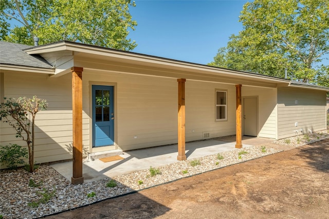 293 S College St, La Grange, TX 78945 - back of house with a patio area and a shingled roof