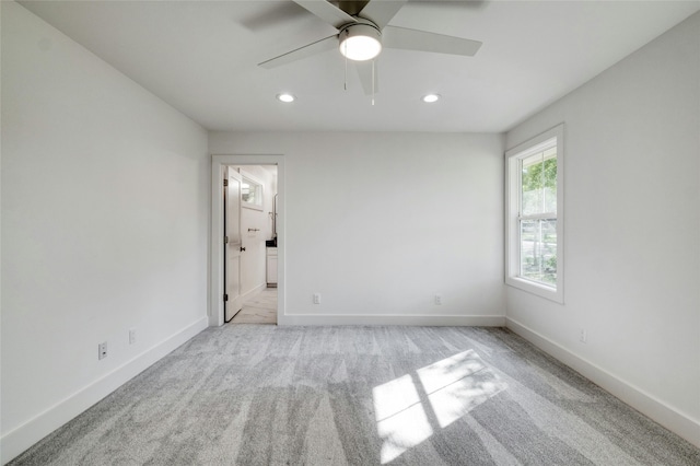 293 S College St, La Grange, TX 78945 - unfurnished bedroom featuring recessed lighting, carpet flooring, baseboards, ensuite bath, and ceiling fan