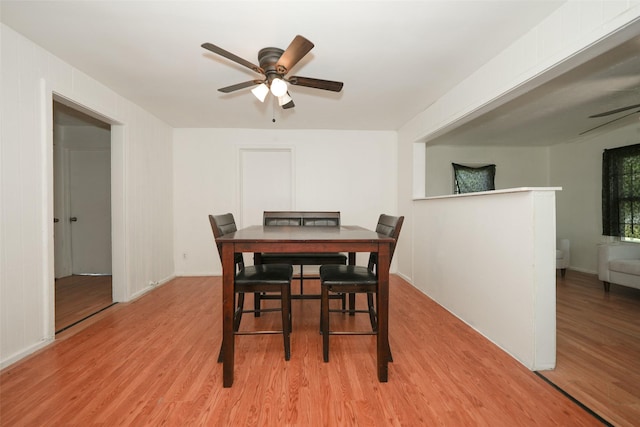 7013 Kittridge St, Houston, TX 77028 - dining area featuring a ceiling fan, light wood-style flooring, and baseboards