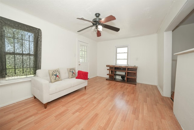 7013 Kittridge St, Houston, TX 77028 - living area with wood finished floors, ceiling fan, and baseboards