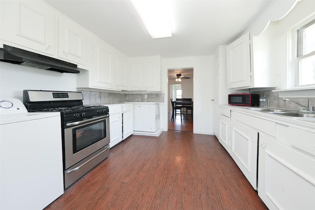 7013 Kittridge St, Houston, TX 77028 - kitchen featuring washer / clothes dryer, under cabinet range hood, stainless steel range with gas cooktop, and light countertops