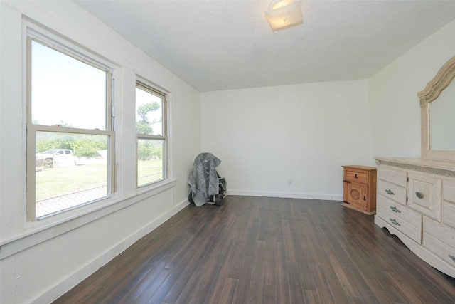 7013 Kittridge St, Houston, TX 77028 - unfurnished bedroom with dark wood-style flooring and baseboards