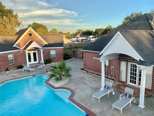 8303 Lanham Ln, Houston, TX 77075 - view of swimming pool with french doors and a patio area
