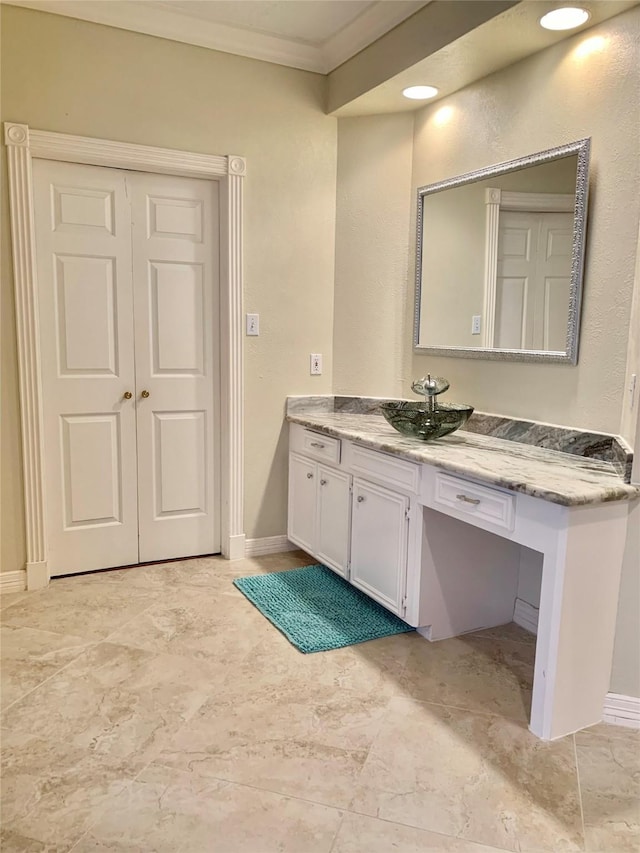 8303 Lanham Ln, Houston, TX 77075 - bathroom featuring ornamental molding, vanity, and baseboards